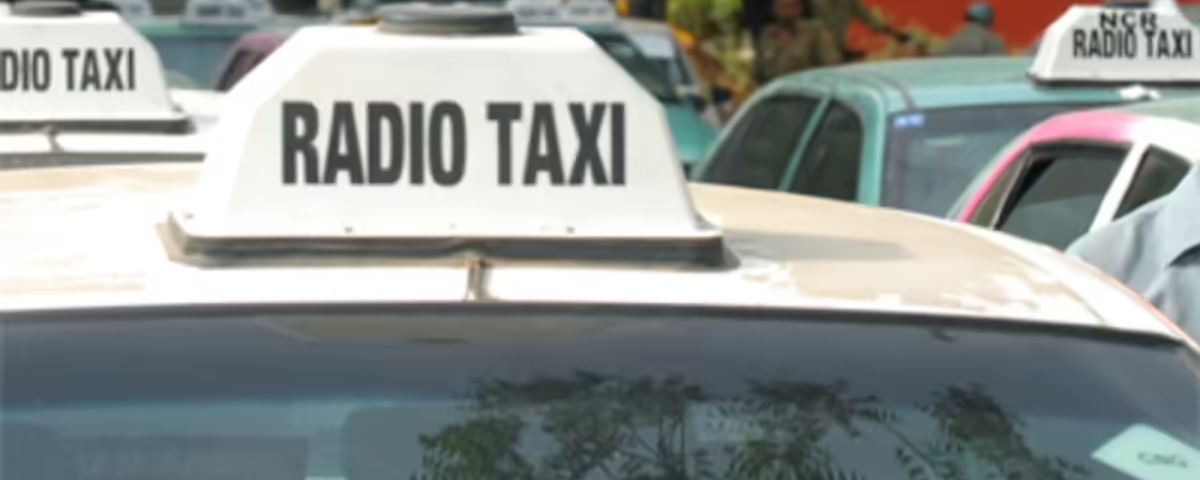 A line of radio taxis parked in an urban area with rooftop “RADIO TAXI” signage prominently displayed on multiple vehicles. The image represents radio advertising in India through branded taxi networks commonly used for transit and outdoor promotional campaigns in high-traffic city locations.