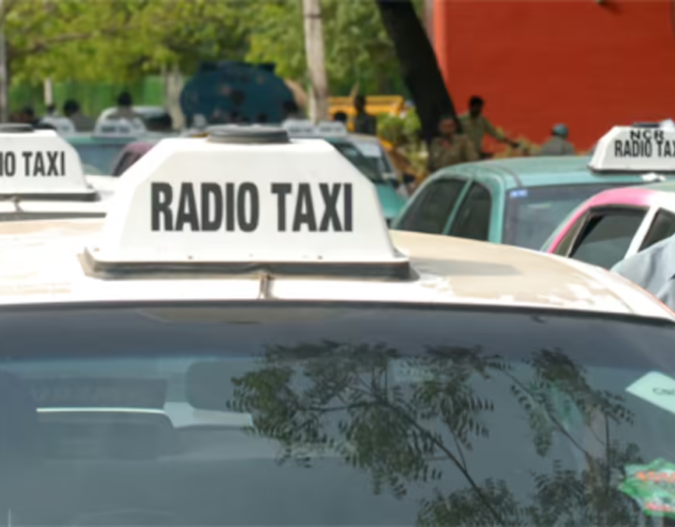 A line of radio taxis parked in an urban area with rooftop “RADIO TAXI” signage prominently displayed on multiple vehicles. The image represents radio advertising in India through branded taxi networks commonly used for transit and outdoor promotional campaigns in high-traffic city locations.