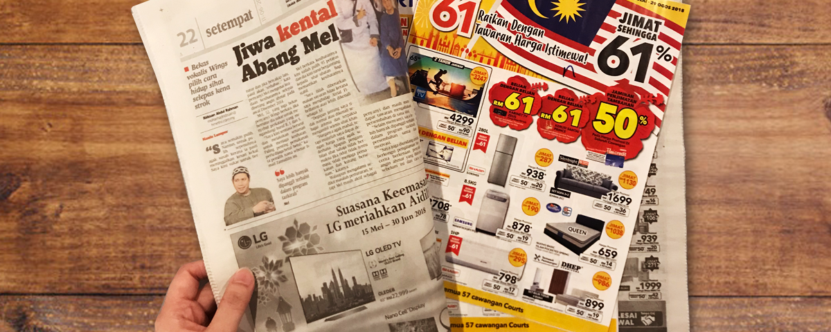 A newspaper insertion advertising campaign featuring promotional retail flyers placed inside a printed newspaper. The image showcases newspaper insert marketing used to distribute brand offers, product catalogs, discounts, and promotional advertisements directly to readers through physical newspaper circulation.