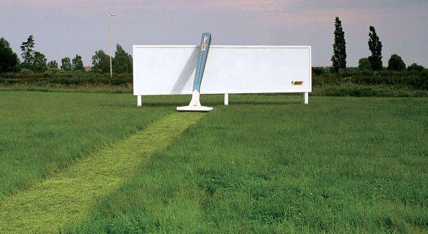 Razor brand billboard advertising where the billboard is placed at green lawn.