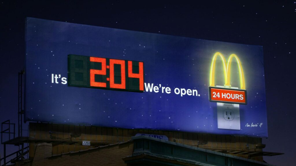 McDonalds We are Still Open Creative Digital Billboard Advertisement which shows the time 