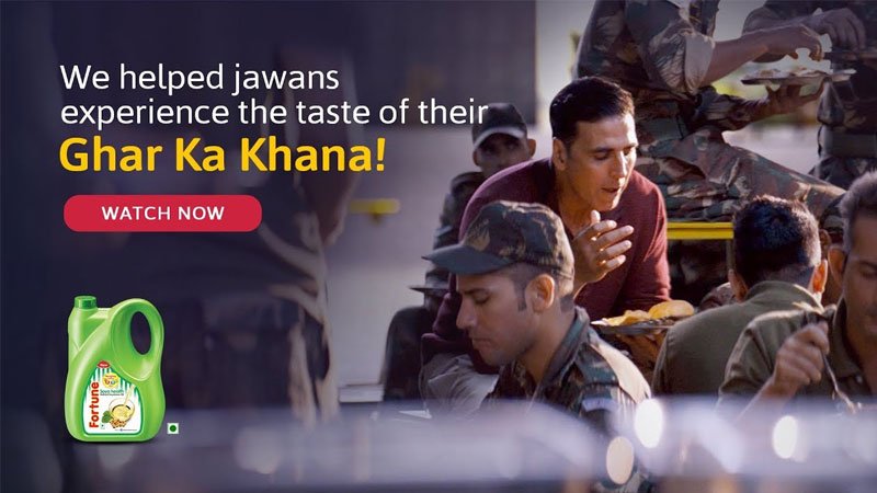 This image shows the branding of Fortune Oil’s Ghar Ka Khana marketing campaign featuring Akshay Kumar with several Indian soldiers
