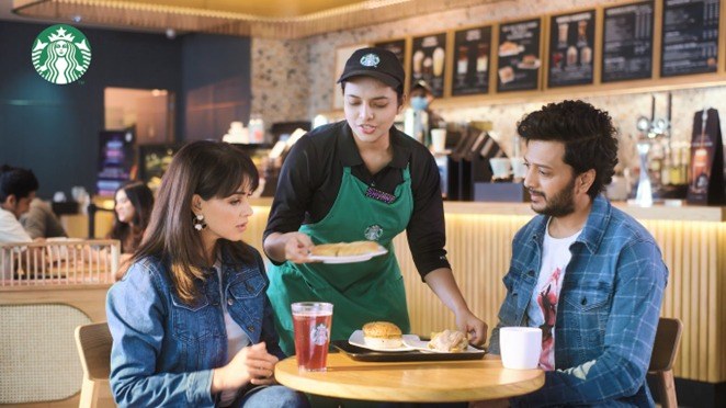 This image shows Ritesh Deshmukh and Genelia D’Souza having vegan meals at Starbucks