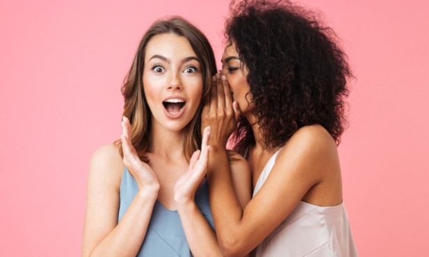A picture showing offline marketing ideas via two young girls talking to each other, possibly discussing word-of-mouth marketing.