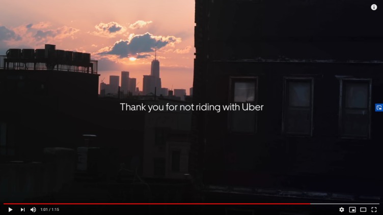 This image shows “Thank you for not riding with UBER” on a background of buildings