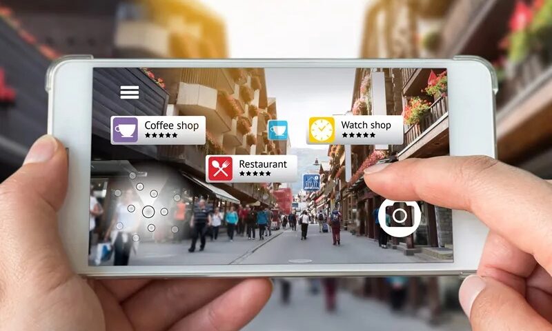 This image shows a street visible from a smartphone with several landmarks as an example of augmented reality
