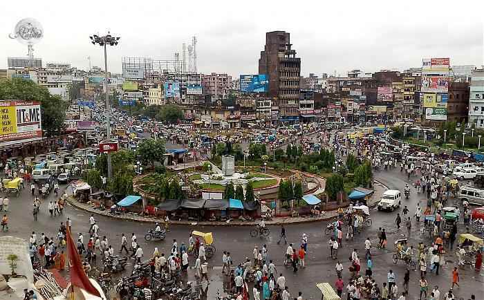 This image shows a busy area with people around and a lot of OOH ads around