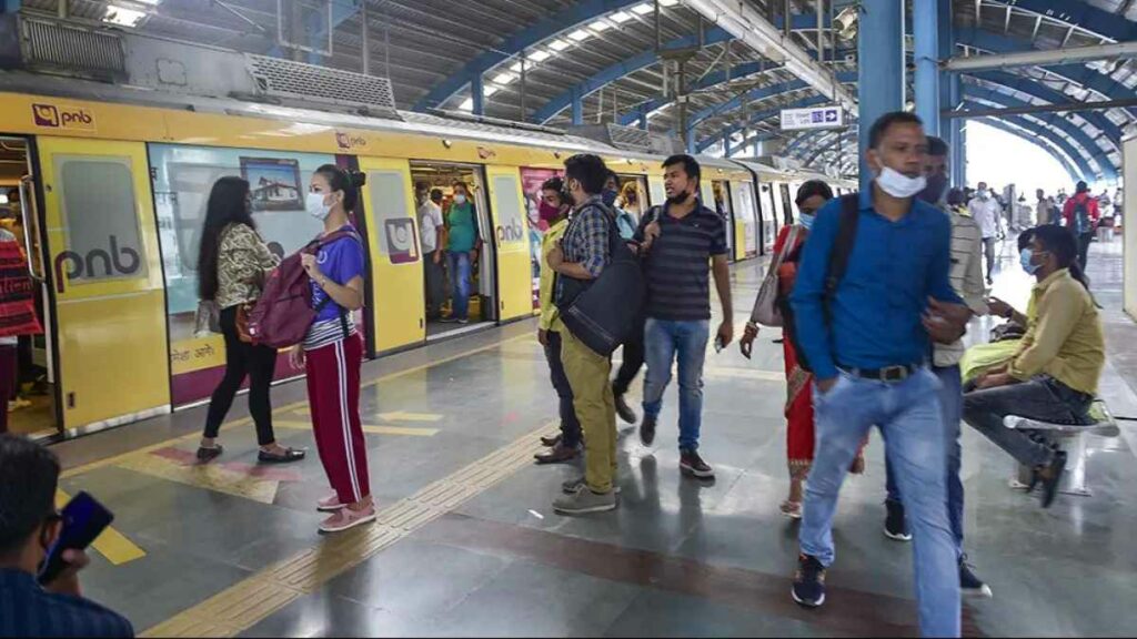 This image shows passengers at a metro station exposed to the PNB metro branding on daily basis making them prospective customers