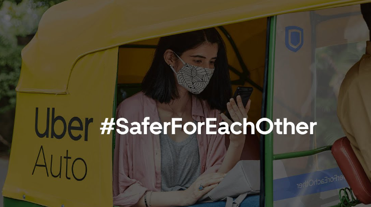 A picture showing offline advertising via a girl in Uber Auto.