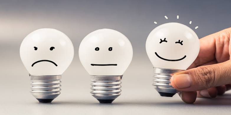 three bulbs are shown with different emotion