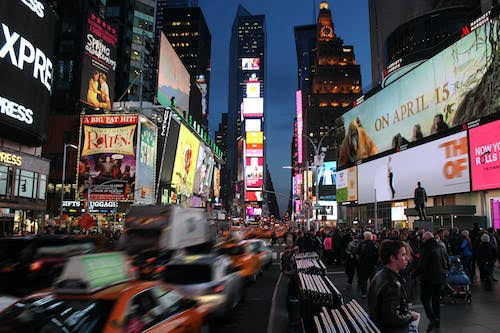  In a busy street video campaign is displayed