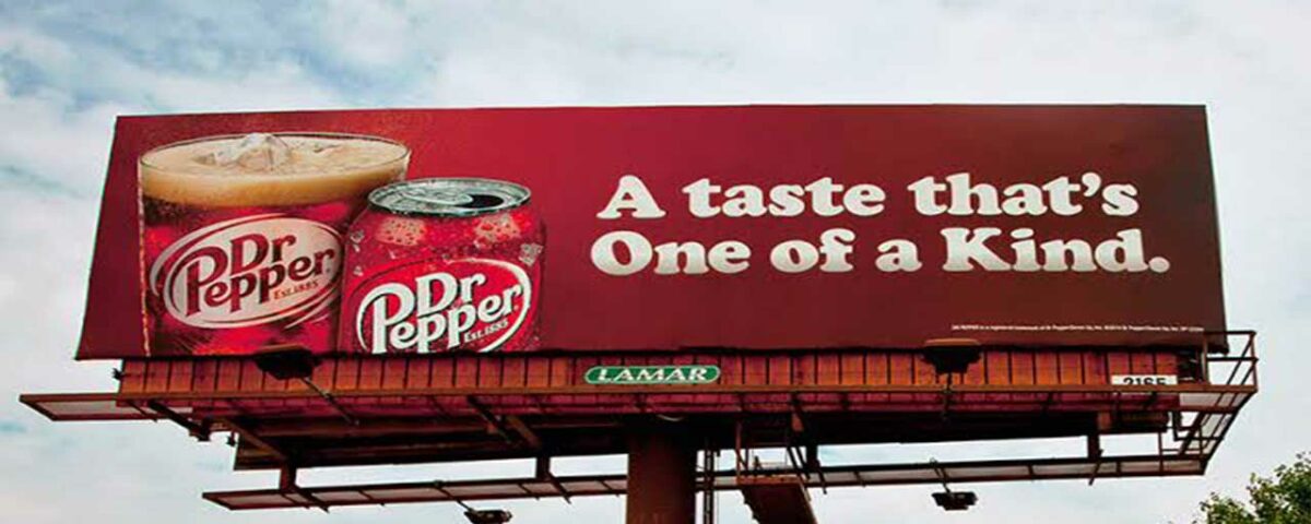 A cold drink advertisement on a billboard.