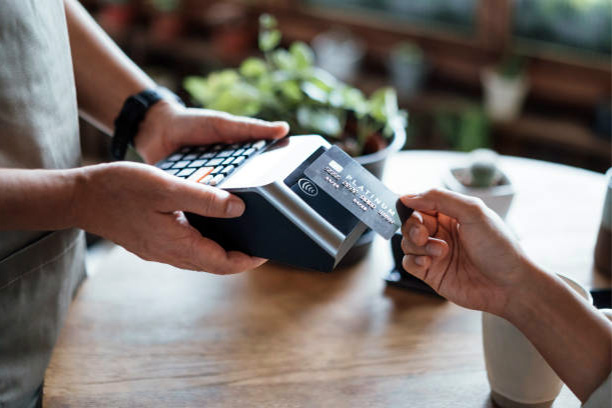 A customer uses his credit card for an impulsive purchase at the store.