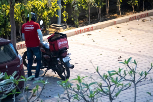 A delivery guy wearing a t-shirt showcasing the unique brand identity.

