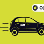 A cab with the Ola logo on a yellow backdrop
