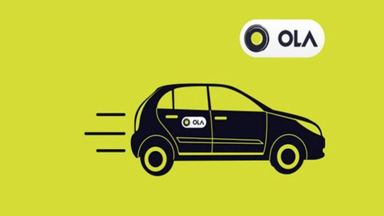 A cab with the Ola logo on a yellow backdrop