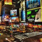 Street filled with outdoor ads.