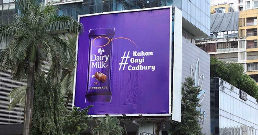 A Cadbury chocolate billboard with a missing Cadbury logo.