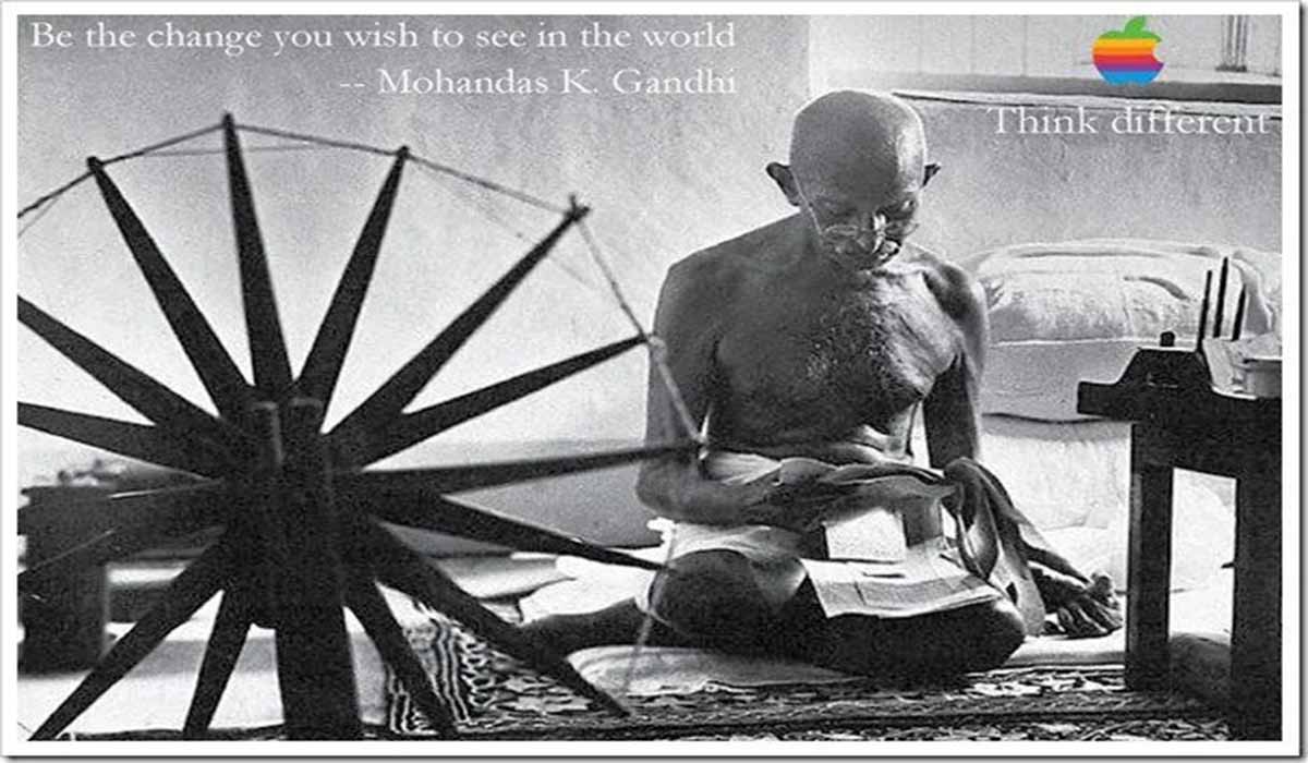 Mahatma Gandhi with his “charkha” and the Think different campaign logo at the upper right corner.