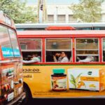 A public bus featuring the advertisement of a popular pharma brand.