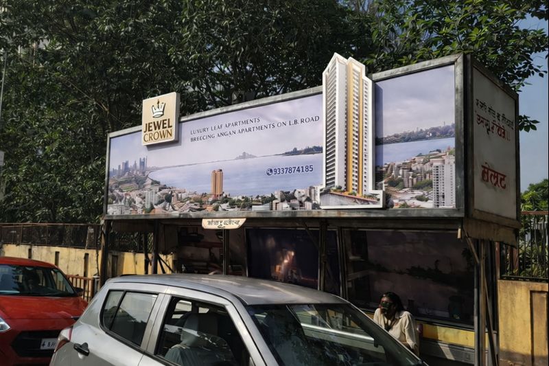 Outdoor hoarding promoting a residential apartment project near a roadway