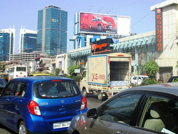 Premium roadside hoarding near a commercial shopping district in Mumbai.