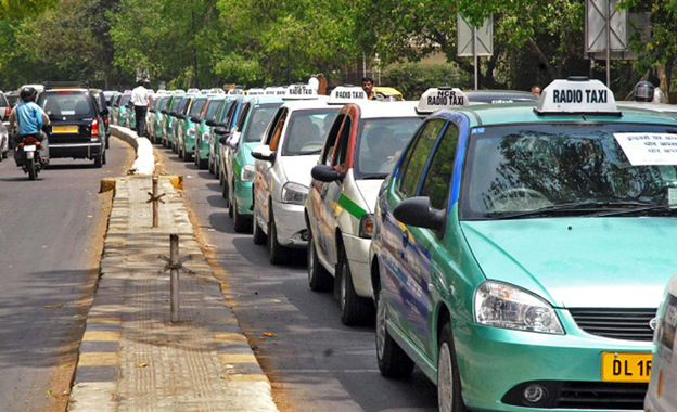 Radio taxi fleet lined up on Delhi roads used for large-scale cab advertising campaigns