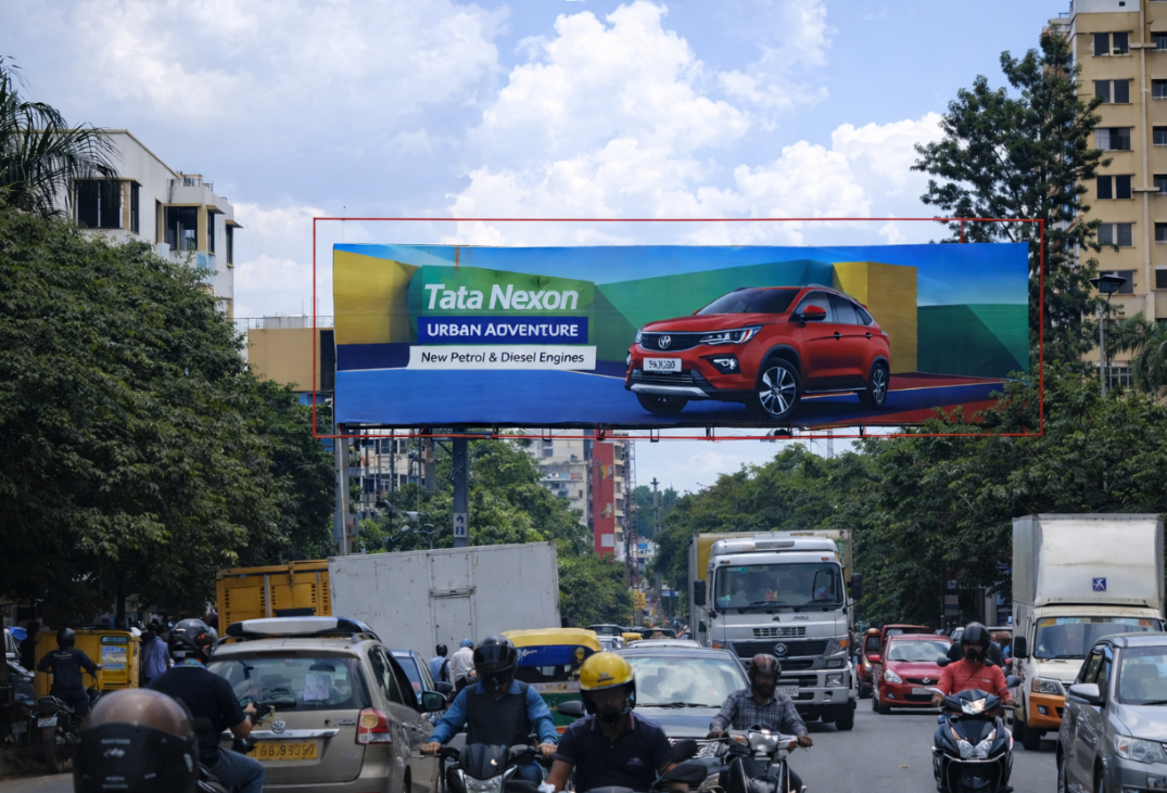 Overhead Billboard Above Traffic With SUV Advertisement Overhead road-spanning billboard displaying a red SUV above heavy city traffic