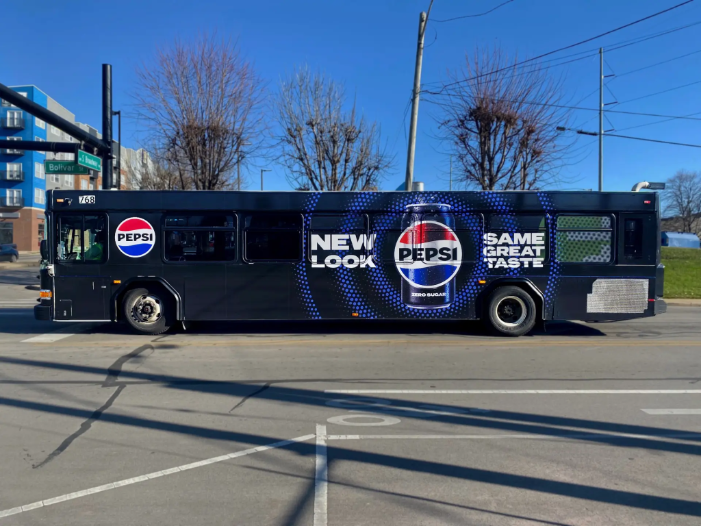 Pepsi Full Bus Wrap Outdoor Advertising Campaign City bus fully wrapped with Pepsi Zero Sugar branding reading “New Look, Same Great Taste.”