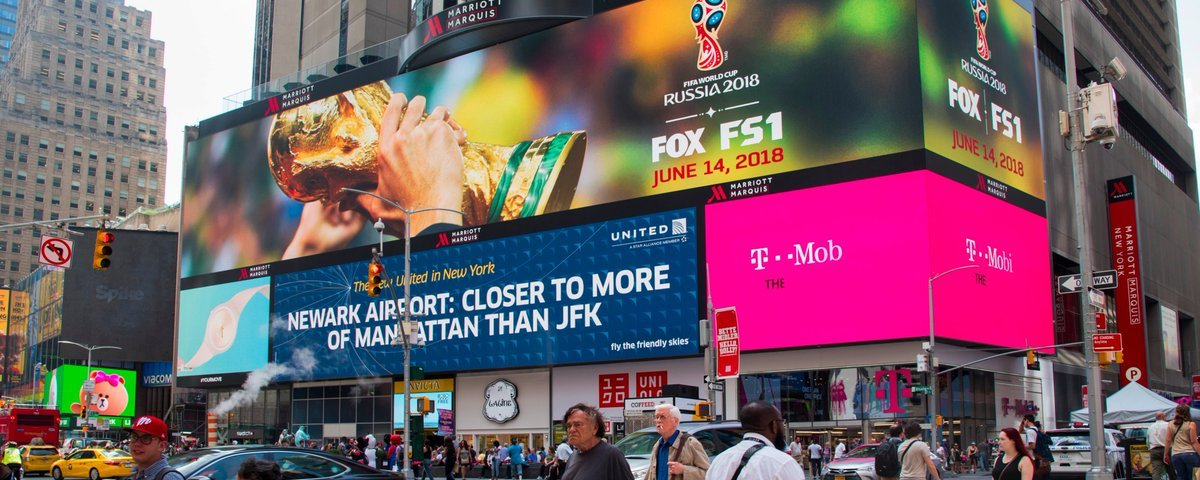 Massive Times Square digital billboard displaying Shopify Black Friday campaign with real-time sales data.