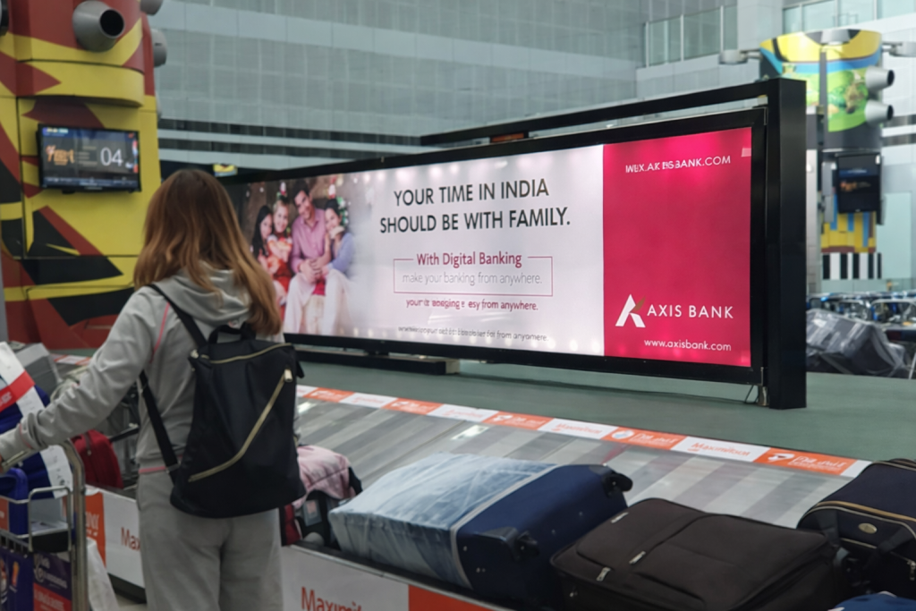 Axis Bank Airport Digital Banking Advertisement Axis Bank digital banking advertisement displayed at airport baggage claim area