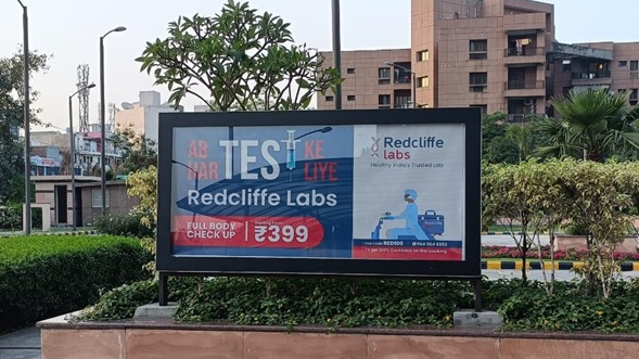 Redcliffe Labs outdoor billboard advertising full body checkup offer in urban residential area India