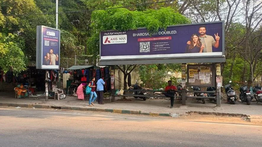 Axis Max Life Insurance bus shelter advertisement with QR code and local audience engagement