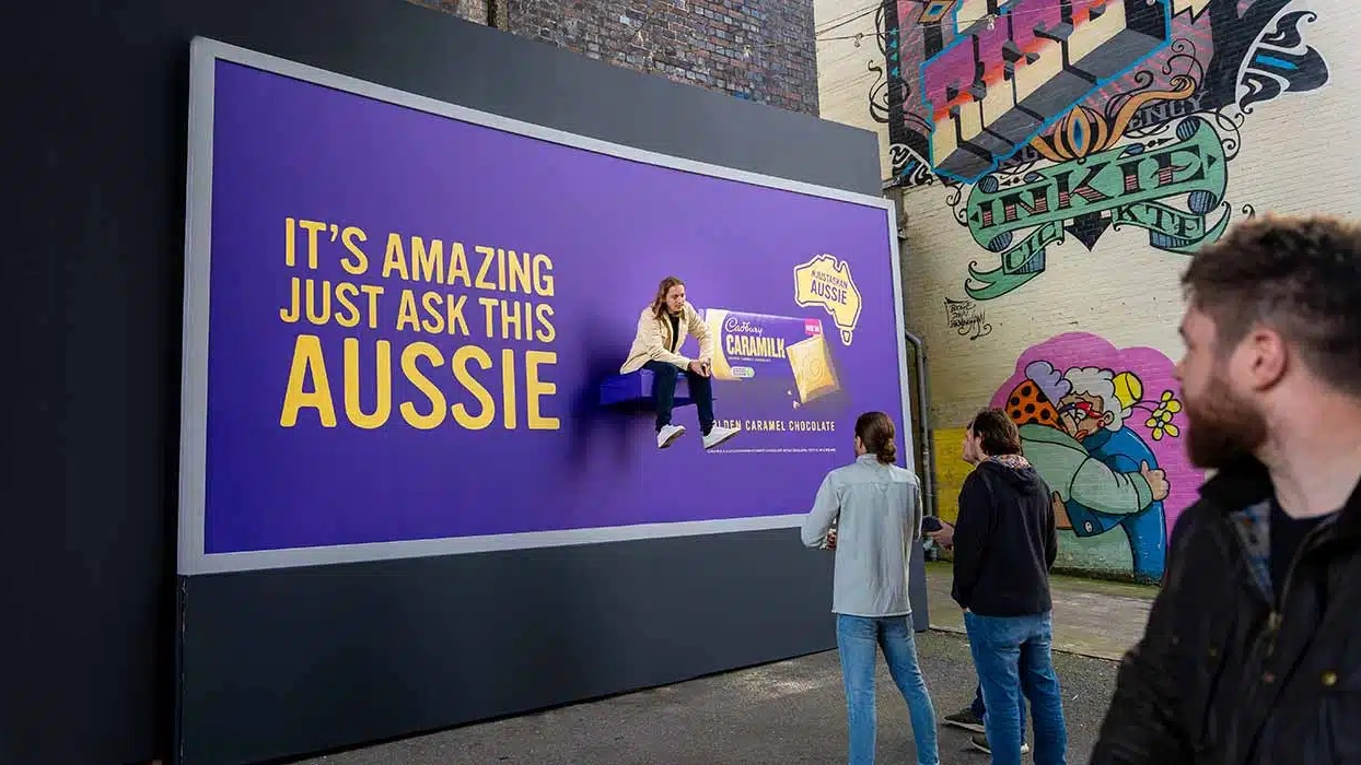 Cadbury Caramilk billboard featuring interactive human element and immersive outdoor advertising