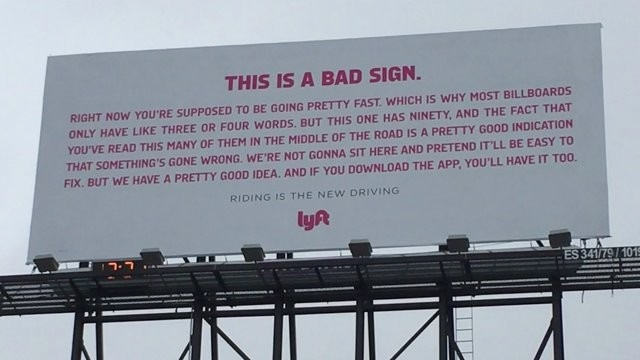Lyft billboard with excessive text demonstrating poor readability in outdoor advertising
