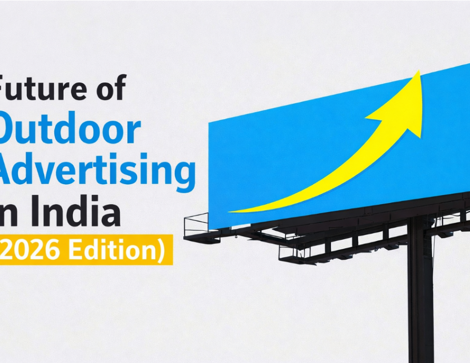 A large roadside billboard with a bright blue screen displays a bold yellow upward arrow, symbolizing growth. On the left side, text reads ‘Future of Outdoor Advertising in India (2026 Edition)’ in a clean, modern font against a light background.