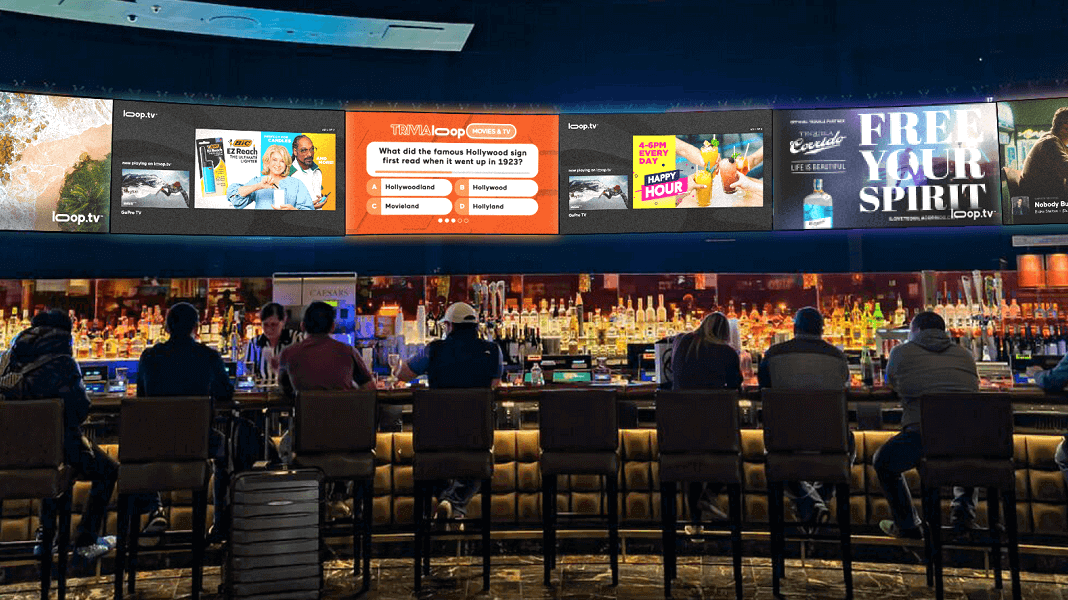 Crowded urban environment with large scale digital billboards demonstrating high reach outdoor advertising inventory