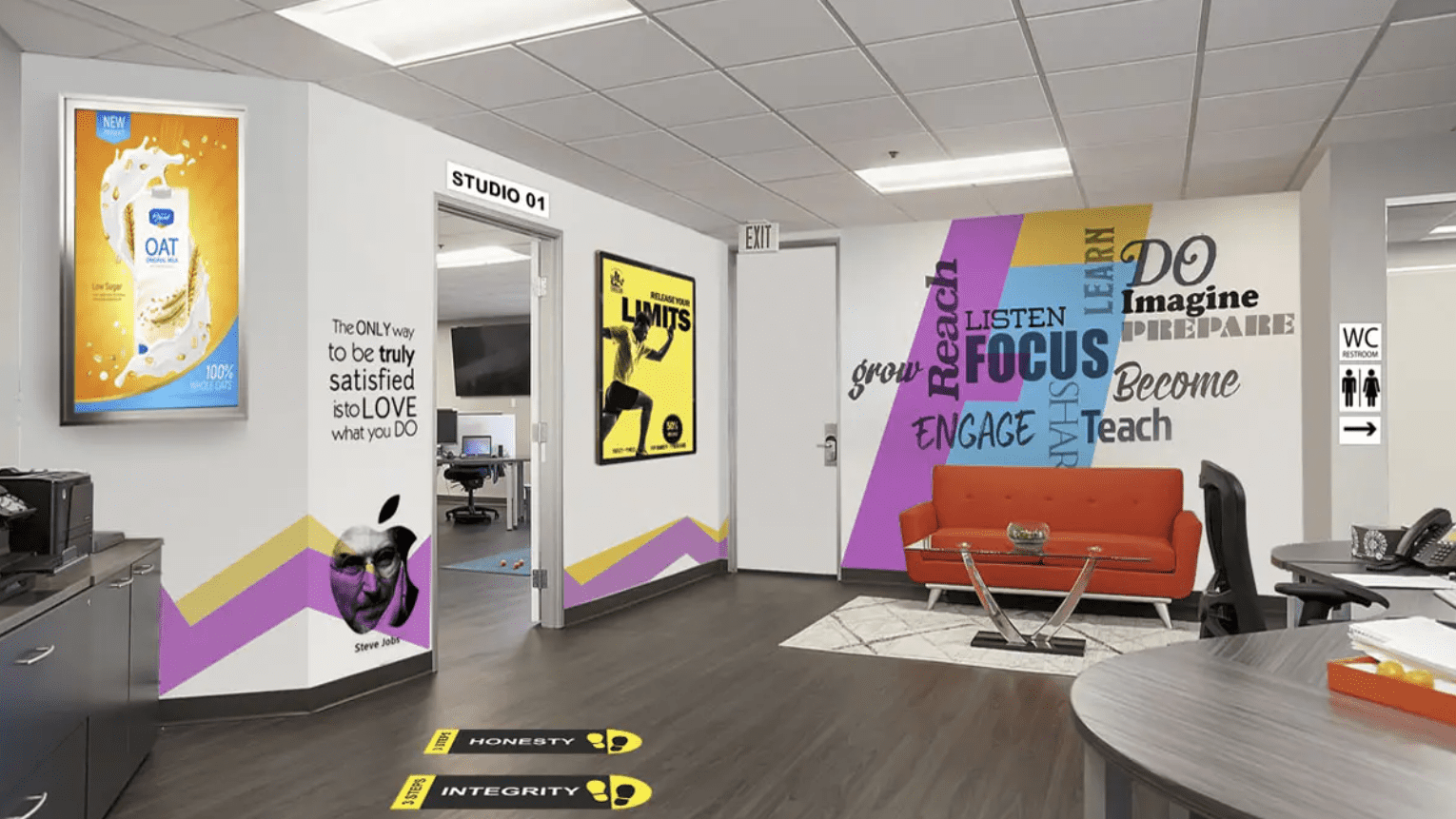 A modern office interior features diverse ambient branding, including motivational wall decals, a digital oat milk advertisement, a Steve Jobs portrait, and "Honesty" and "Integrity" vinyl floor graphics.