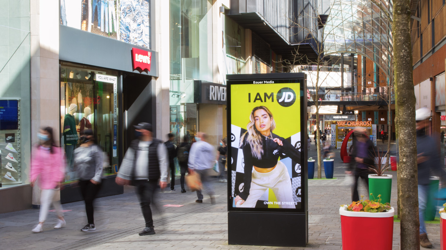 JD Sports street furniture advertising campaign in high footfall retail area