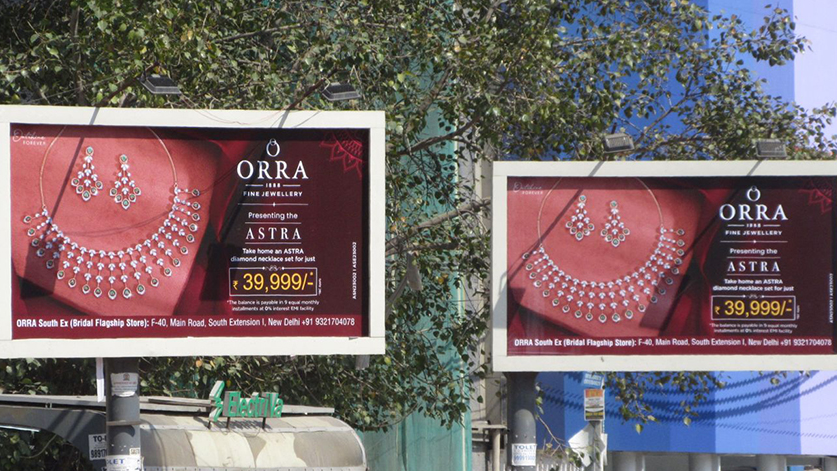 ORRA jewellery billboard campaign showcasing Astra diamond collection Dual roadside billboards promoting ORRA fine jewellery Astra collection with diamond necklace visuals and pricing offer