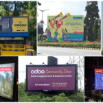Large digital out of home billboards in urban city square displaying premium brand advertisements and high footfall audience
