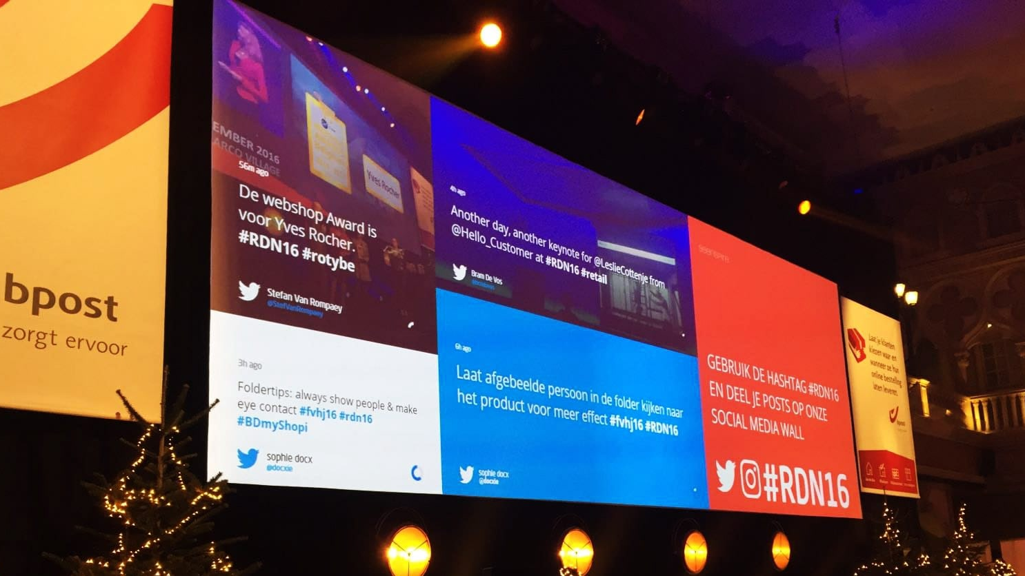 Live Social Media Wall: A large-scale event display featuring a real-time social feed, encouraging attendees to use a specific hashtag to see their posts and photos curated live on the big screen.