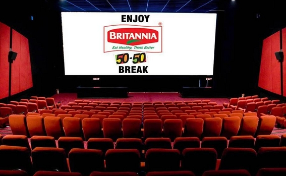 A cinema screen displays a Britannia 50-50 advertisement inside a theatre auditorium. Positioned before the movie screening, the ad reaches audiences in a distraction free environment, making cinema advertising a high attention format for brand recall and engagement.